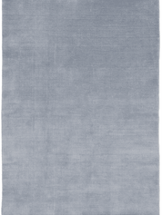 Frilagd bild av handvävd ullmatta Solid Blå, rektangulär med kort lugg och diskret lyster.