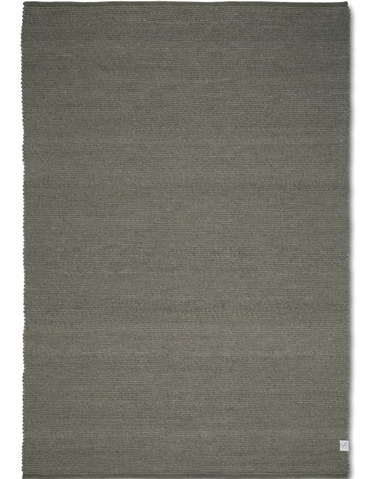 Rectangular area rug in a solid olive green, featuring a textured, woven wool-blend construction.