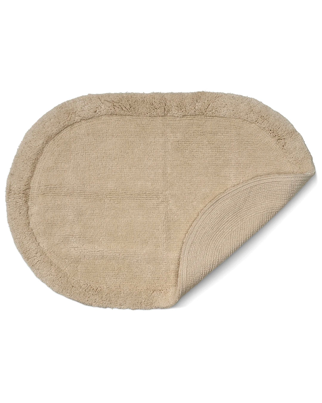 Beige badrumsmatta Border Oval i bomull, 60x90 cm, med uppvikt hörn som visar mattans struktur och baksida.