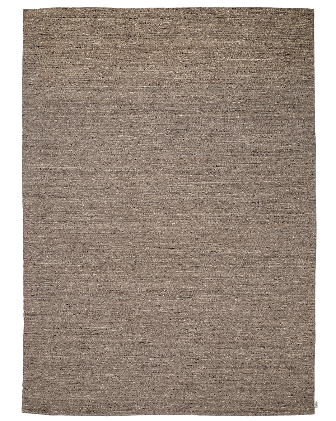 Bouclé-matta sedd ovanifrån, i brun ton med melerade inslag och tät texturerad yta.