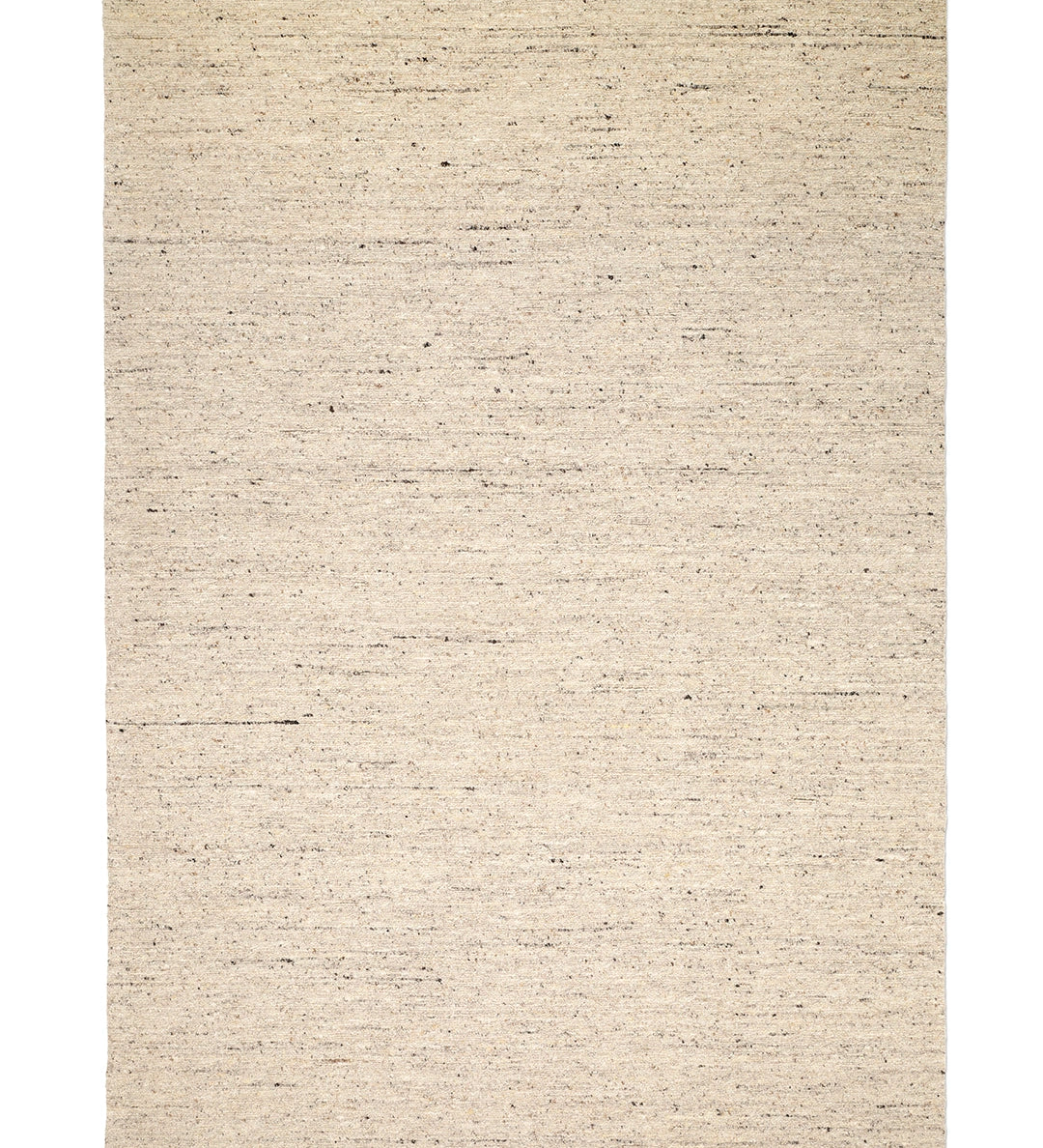 Bouclé-matta sedd ovanifrån, i ljus beige ton med diskreta mörka melerade inslag och tät texturerad yta.