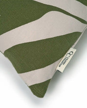 Olive green and beige patterned throw pillow with Classic Collection fabric label.