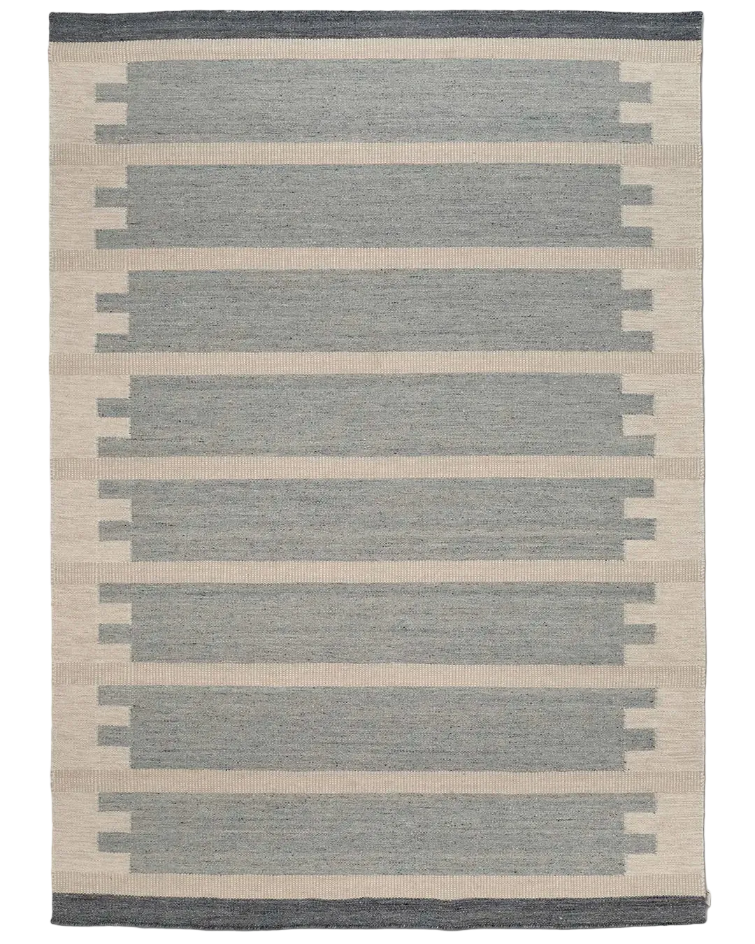 Vävd matta med geometriskt mönster i blått och beige, perfekt för en modern inredning.