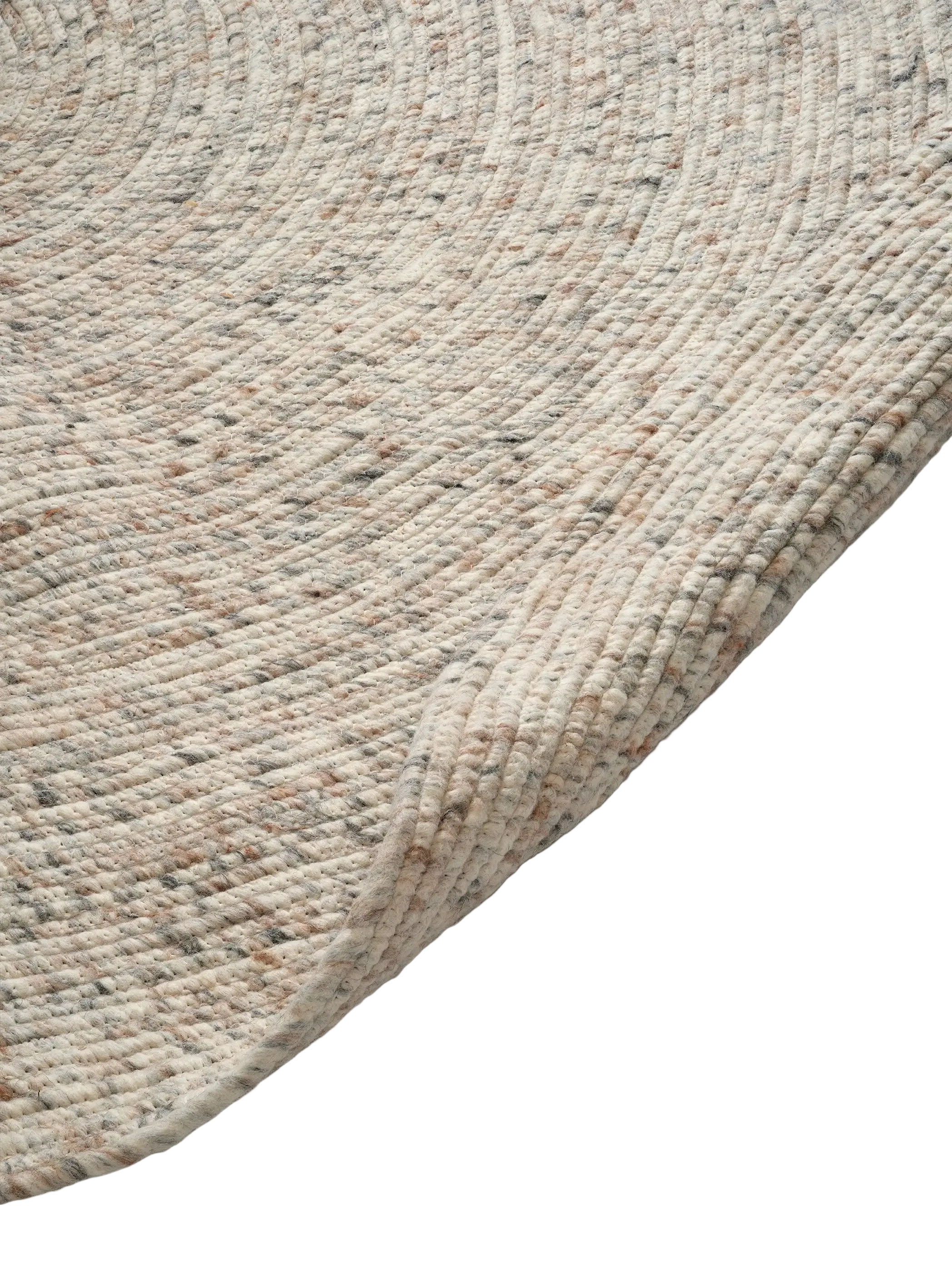 Detaljbild av rund ullmatta Merino i naturbeige melerad färg som visar vävstruktur och rundad kant i ull