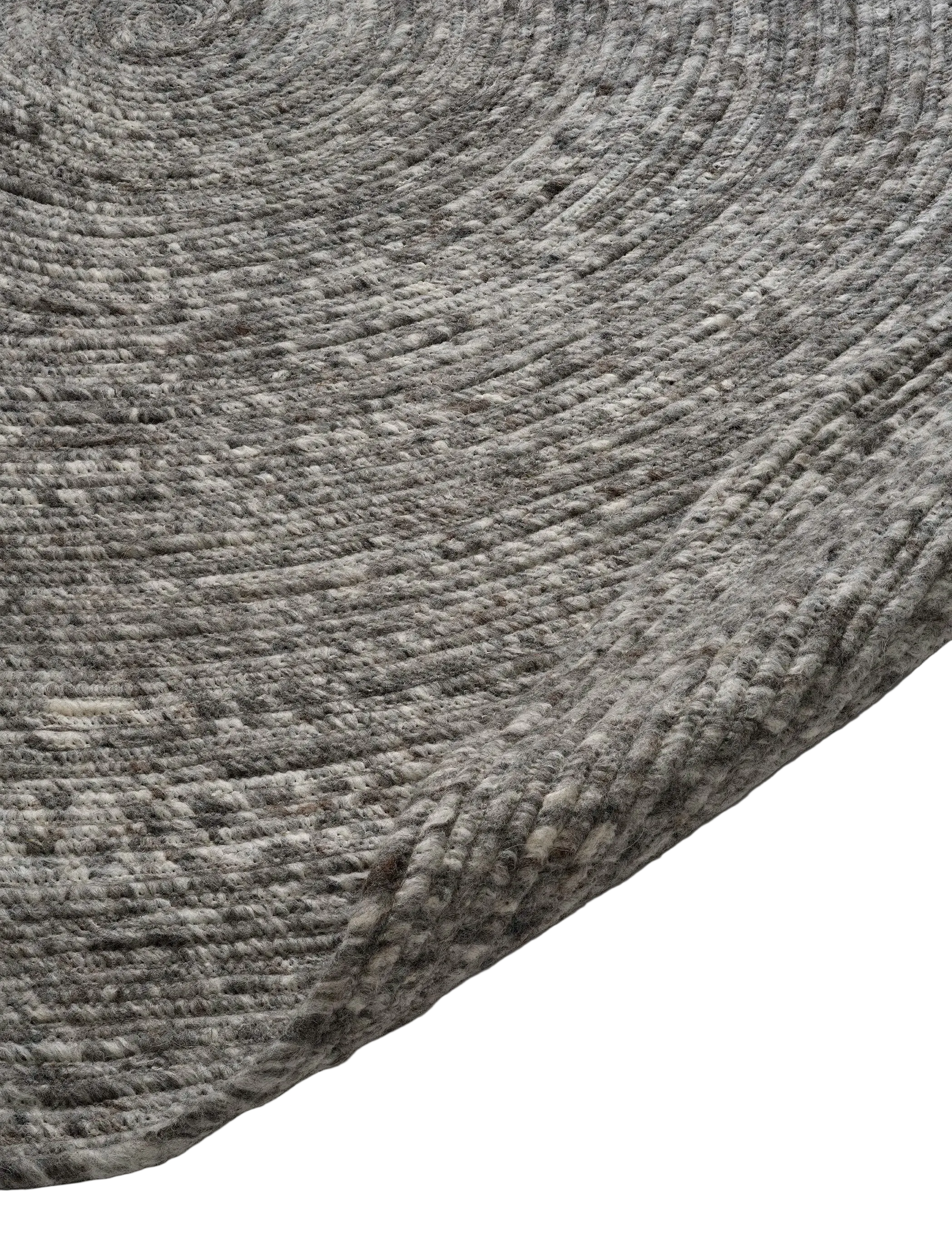 Close-up of a round, grey wool braided area rug with a textured, mottled pattern.