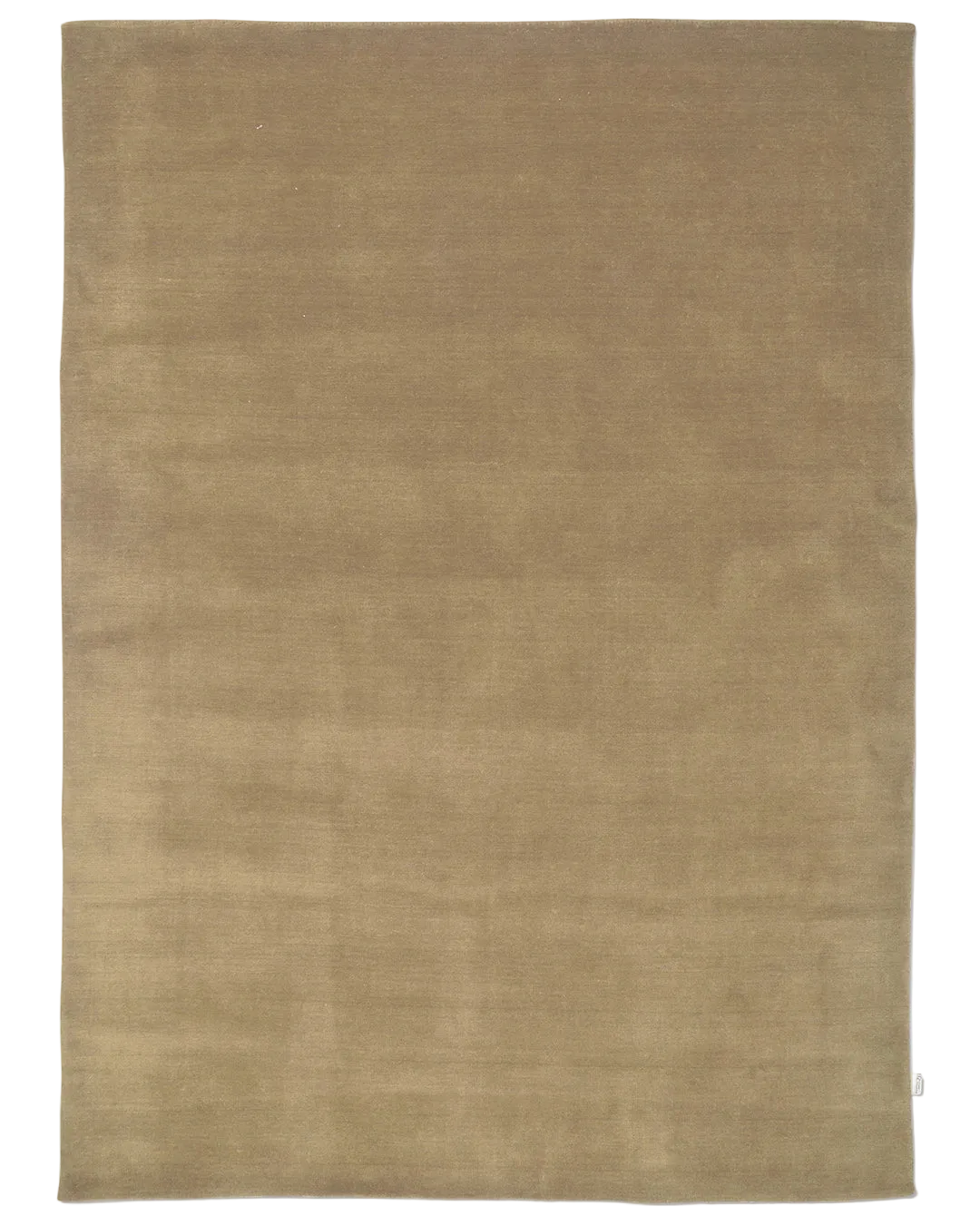 Handvävd ullmatta Solid Wheat i varm beige ton med tät, fyllig lugg.