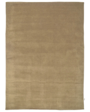 Handvävd ullmatta Solid Wheat i varm beige ton med tät, fyllig lugg.