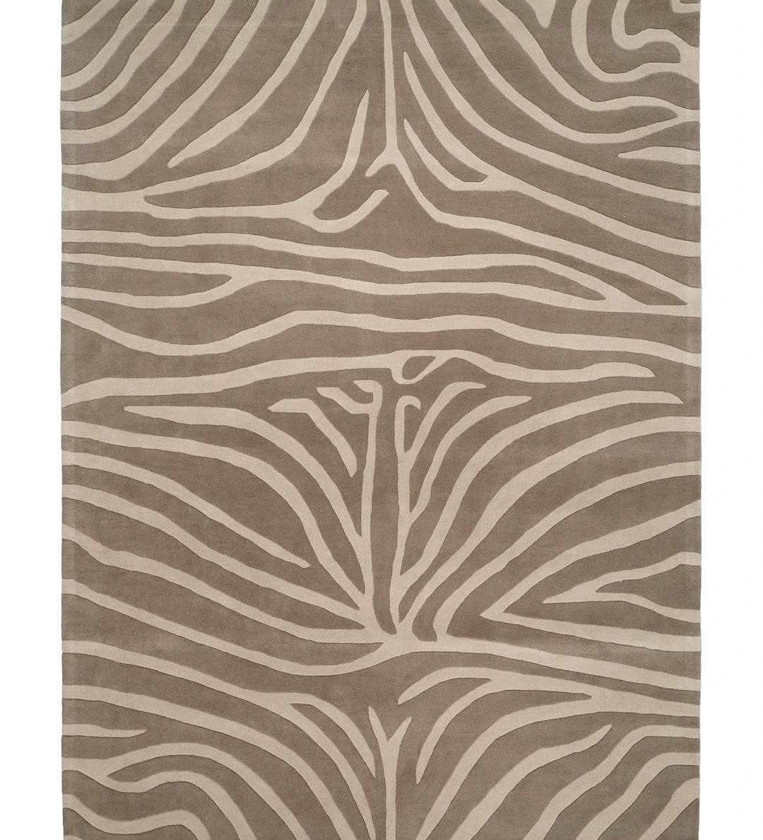 Handtuftad ullmatta Zebra Beige med zebrainspirerat mönster i beige och naturvit ton.