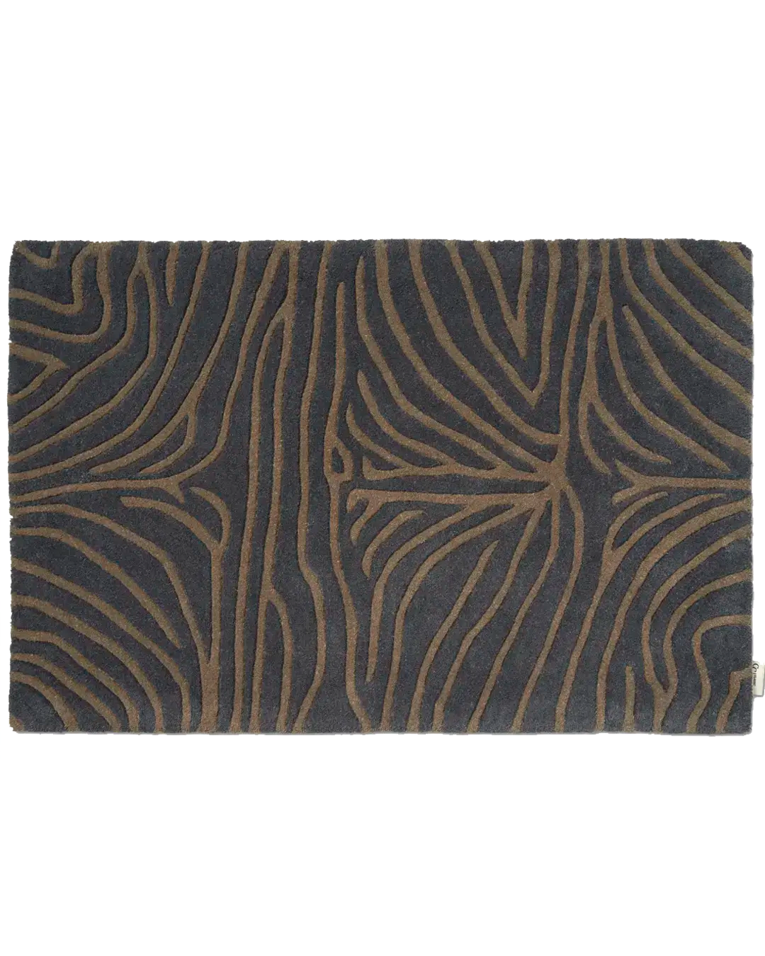 Närbild av handtuftad dörrmatta Zebra Horizon i ull med zebra-inspirerat linjemönster i bruna toner på mörk botten.
