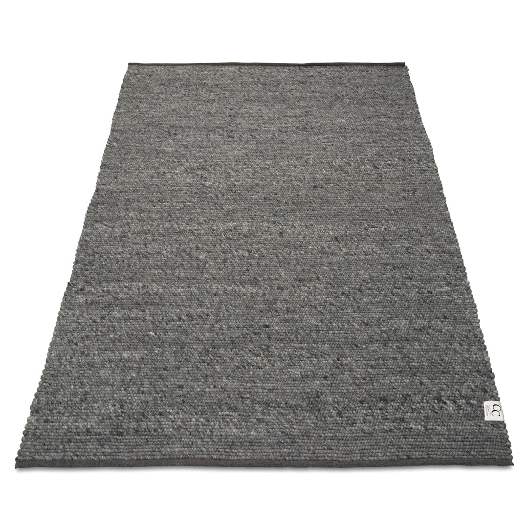 Rectangular grey wool area rug with a textured, chunky woven pattern and a clean-finished edge.