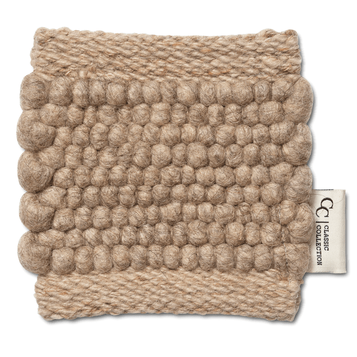 Beige wool rug swatch with a textured, rounded bubble pattern and woven border, featuring a Classic Collection brand tag.