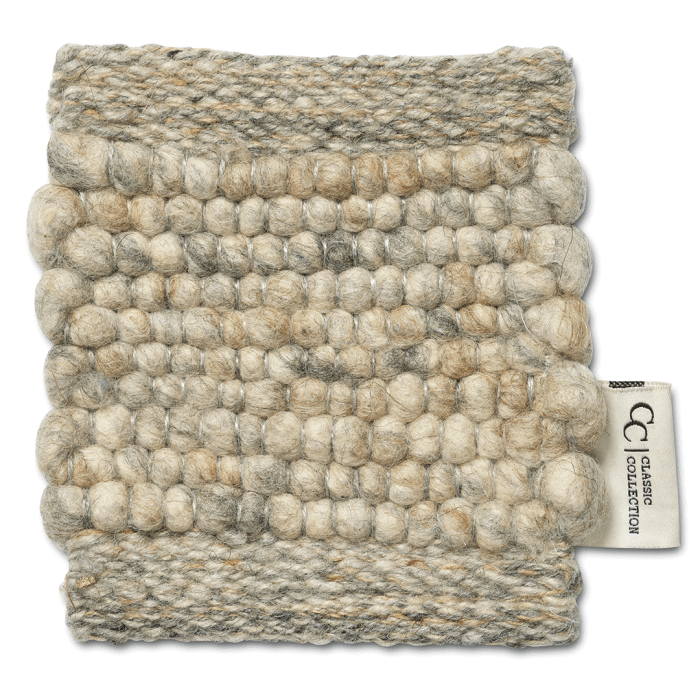 Beige and grey textured wool rug sample with a thick, hand-woven knotted pattern and Classic Collection fabric tag.