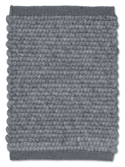 Rectangular grey wool area rug featuring a textured, felted ball pattern with solid woven border edges.
