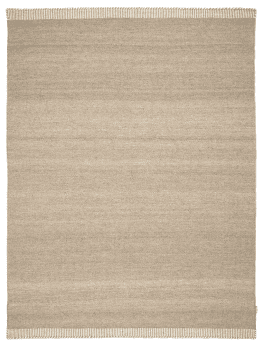 Enfärgad ullmatta i mjuk naturbeige ton med tvåfärgade kortsidor